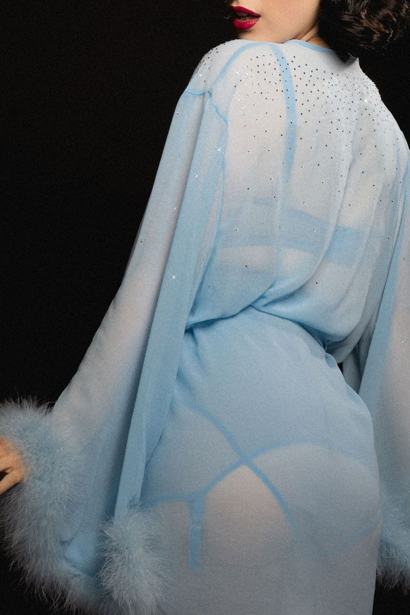 model wears sheer blue robe
