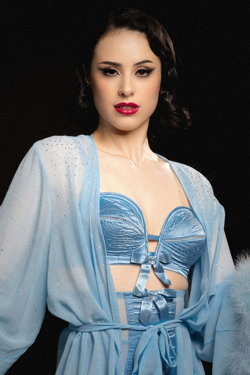 model wears sheer blue robe