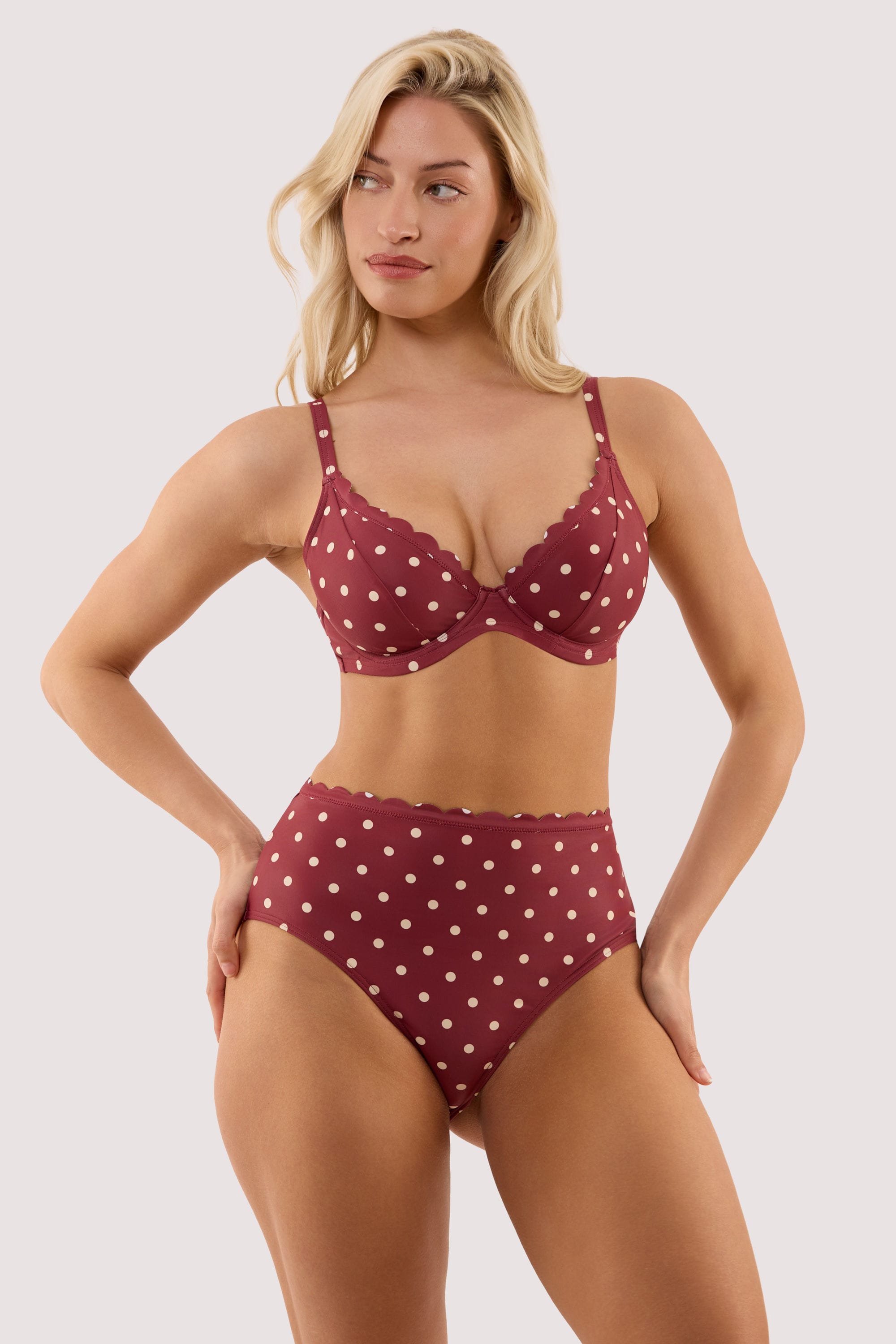 Model wears a hazel wine spot underwired bikini top with a matching high waist bikini brief.