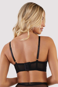 model shows us the back of the Eddie black crossover bra with lingerie set