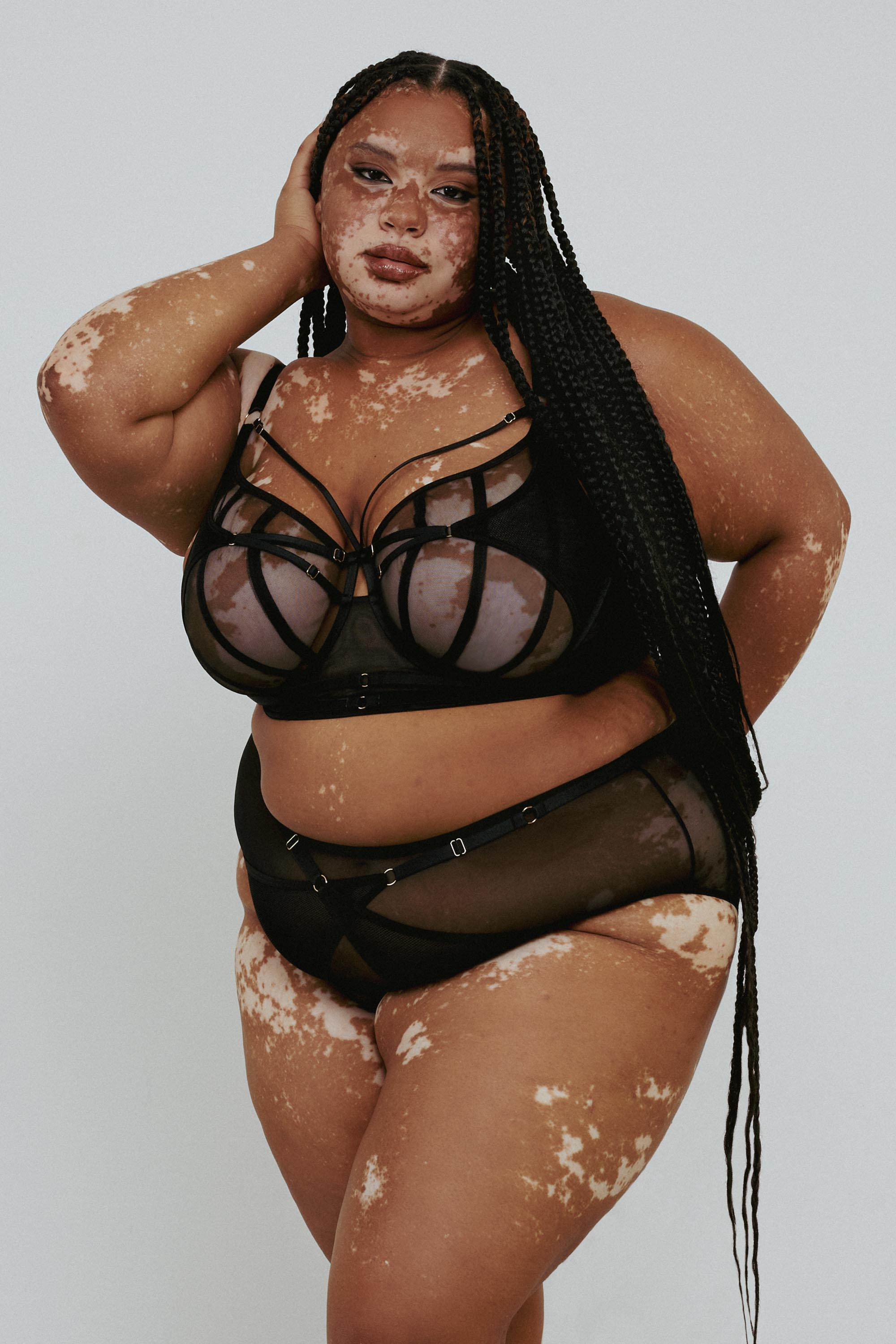 model wears Eddie black crossover bra with lingerie set
