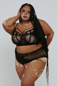 model wears Eddie black crossover bra with lingerie set