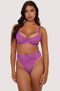 Model wears purple strappy lace plunge bra and high waist thong lingerie set