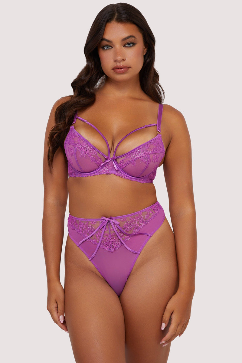 Model wears purple strappy lace plunge bra and high waist thong lingerie set