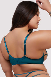 model shows teal mesh hook and eye fastening bra back