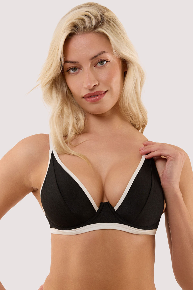 Model wears a ally black & ivory underwired bikini top with underwire cup.