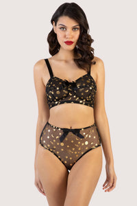 model wears Solar black and gold cosmic print high waist brief with solar black and gold cosmic bullet bra